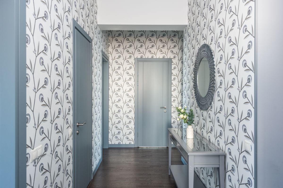 Living room with textured wallpaper accent wall — quiet luxury interior design by D. Marie Interiors