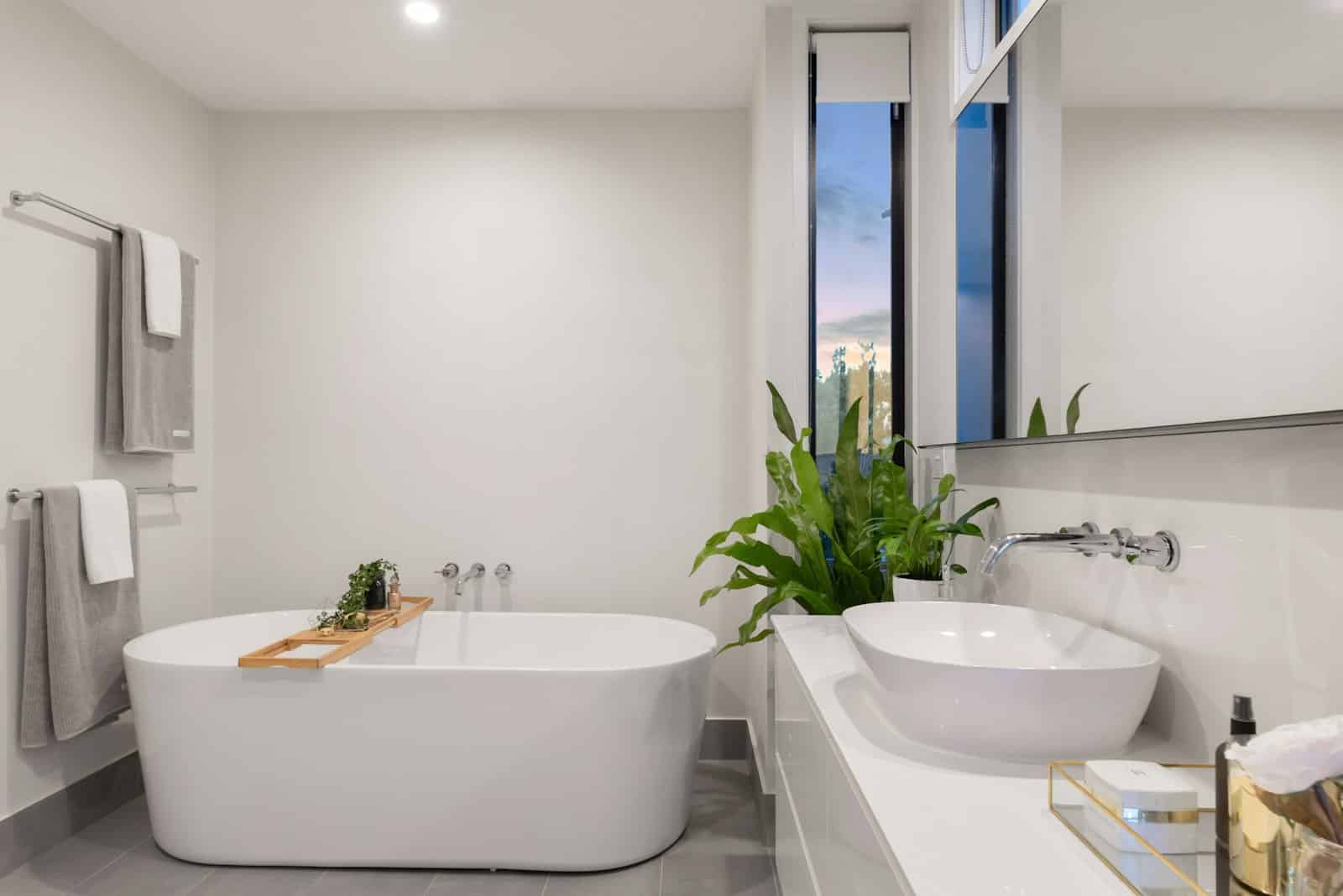 Upscale modern bathroom remodel near Suncadia resort with freestanding soaking tub and spa-style finishes