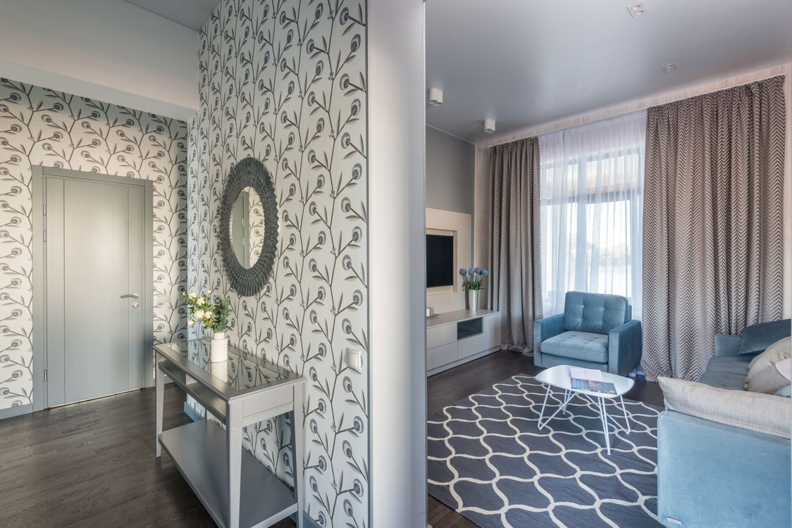 Living room with elegant vine pattern wallpaper